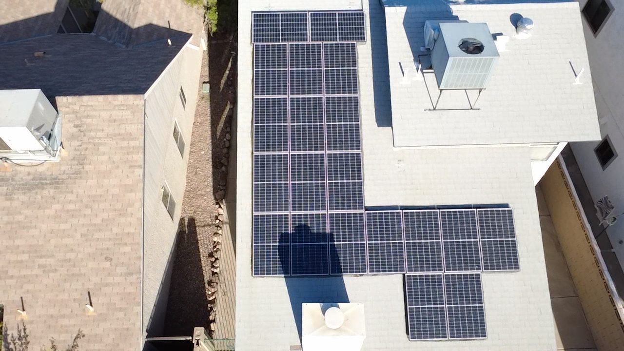 Overhead aerial drone view of residential roof and solar layout for documentation
